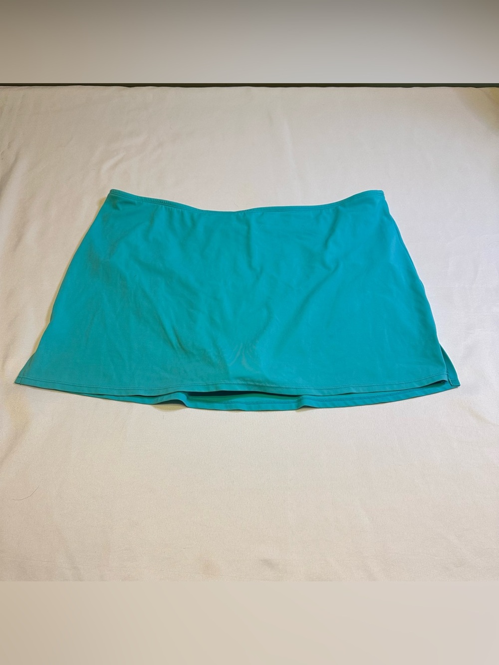 Turquoise swim/skirt bottoms.